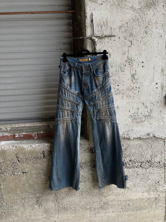 MULTI ZIPPED FLARED DENIM PANTS