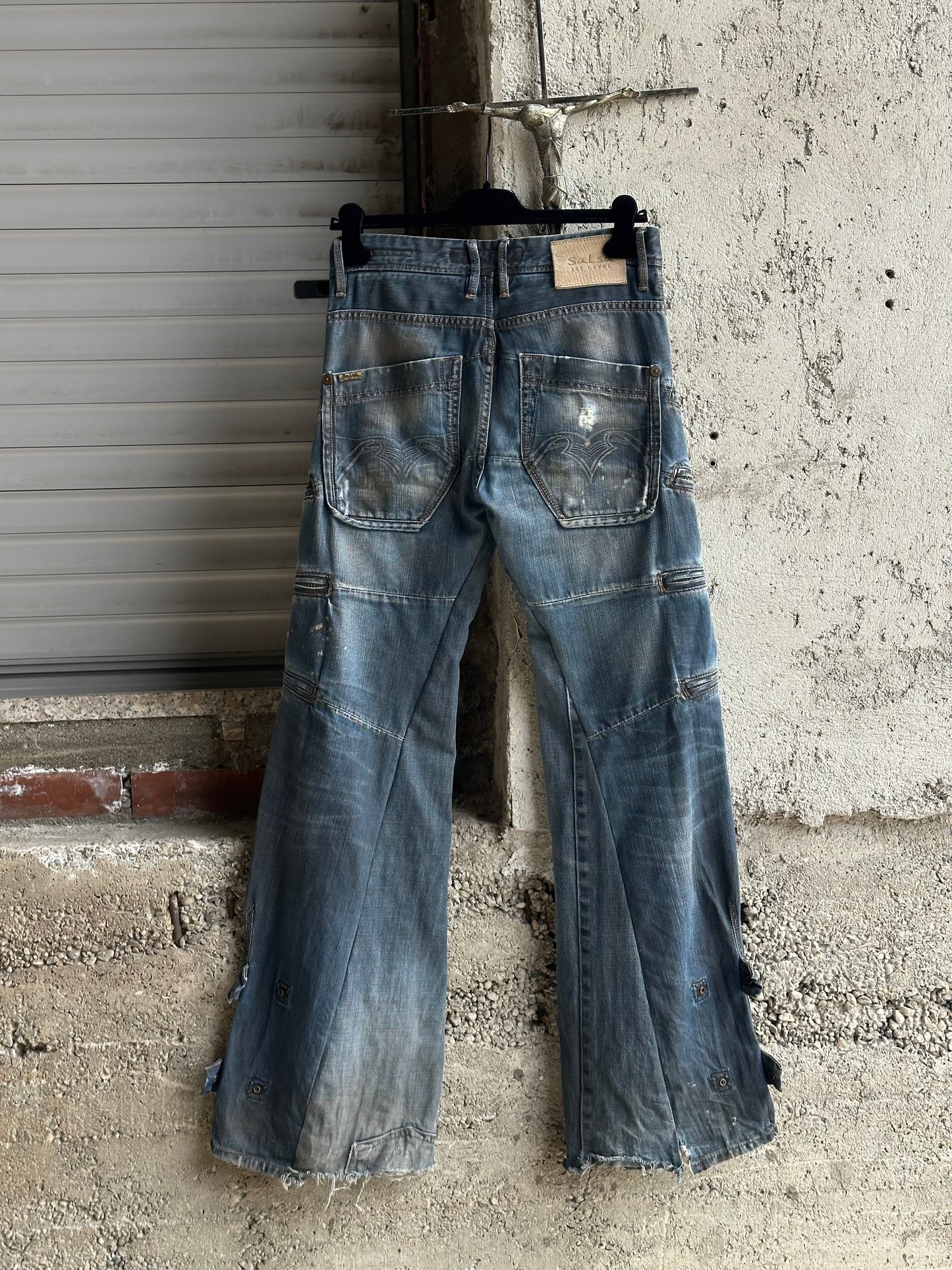 MULTI ZIPPED FLARED DENIM PANTS