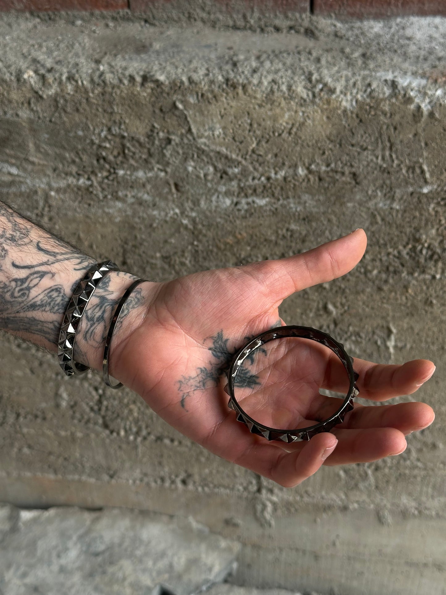 THREE STUDDED SILVER BRACELETS