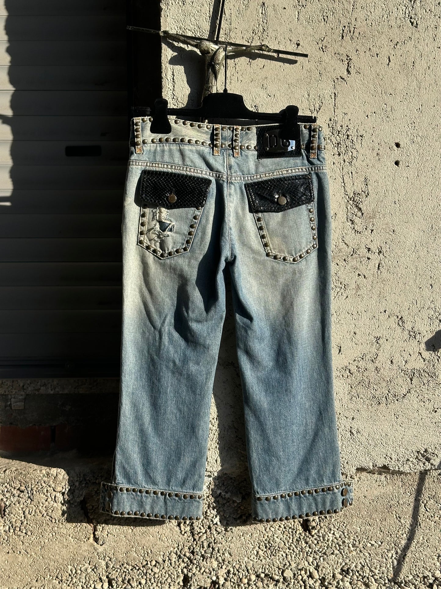 DOLCE & GABBANA DENIM AND LEATHER STUDDED CAPRI