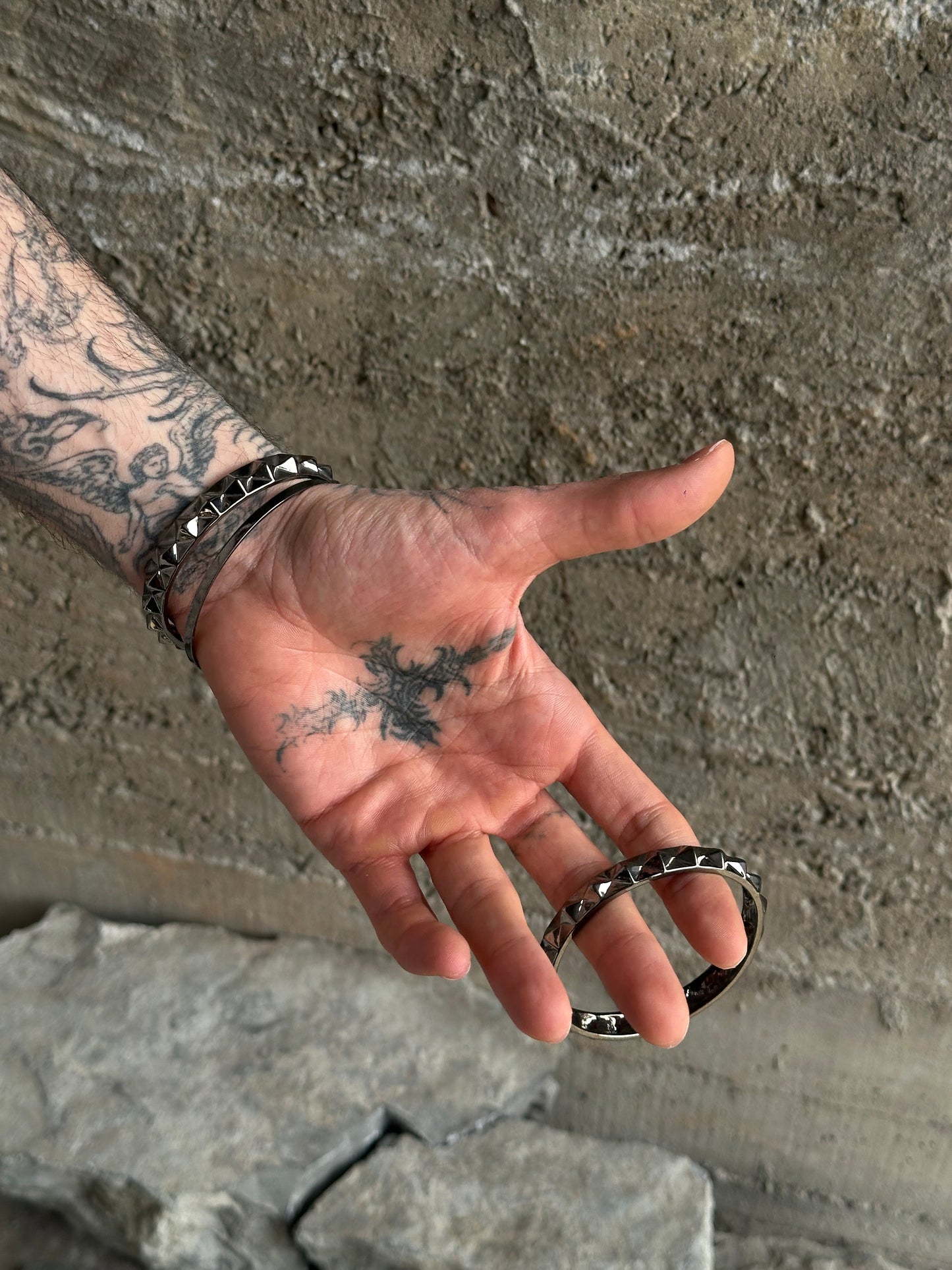 THREE STUDDED SILVER BRACELETS